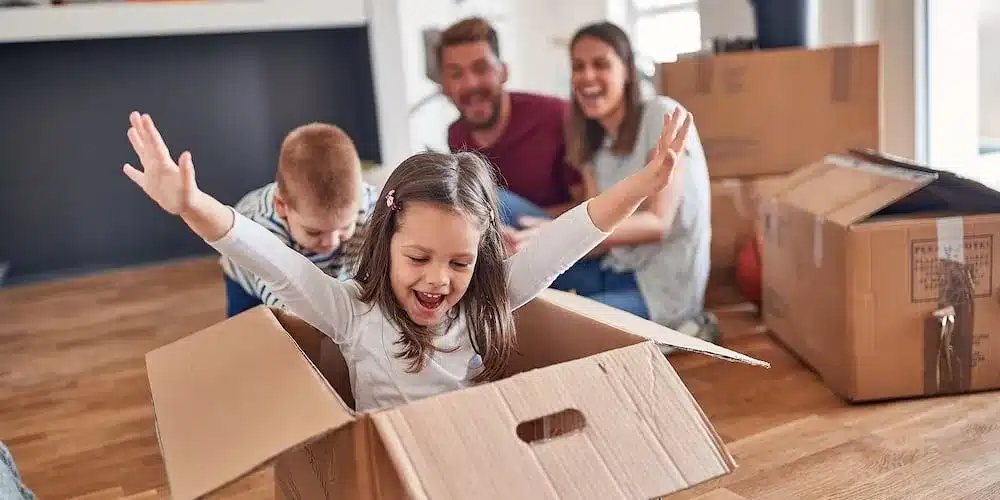 A family moving into a more affordable home to reduce housing costs while learning how to budget money on low income. 