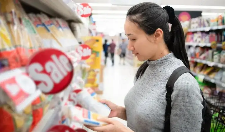 Maximizing savings by using grocery coupons when you spend or use money