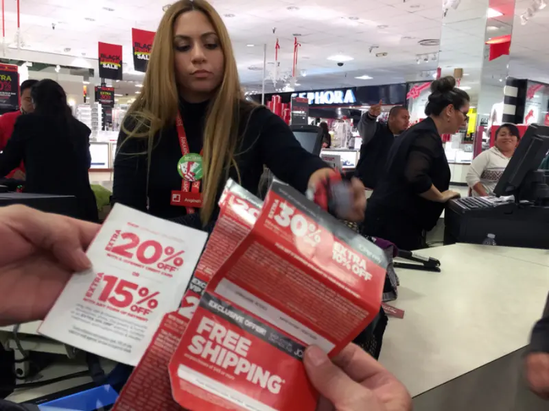 Shopper using coupons for smart spending when you spend money at the store